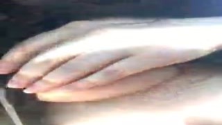 The sun was beating down on her face as she laid on the grass in the middle of the park