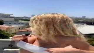 Her tits hung heavy, her hard nipples jutting out from the thin fabric of her shirt