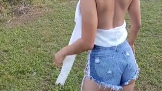 xania moving the lawn with a trimmer on a cool day