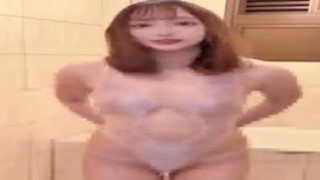 A hot hunk in an ass-hugging swimsuit is right up against the glass, giving everyone a view of his massive bulge