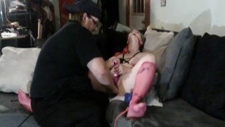 She was bound to the couch, her legs spread wide and a thick gag shoved into her mouth, muffling her cries of lust as he pulled out his thick cock and pointed it right at her dripping wet pussy